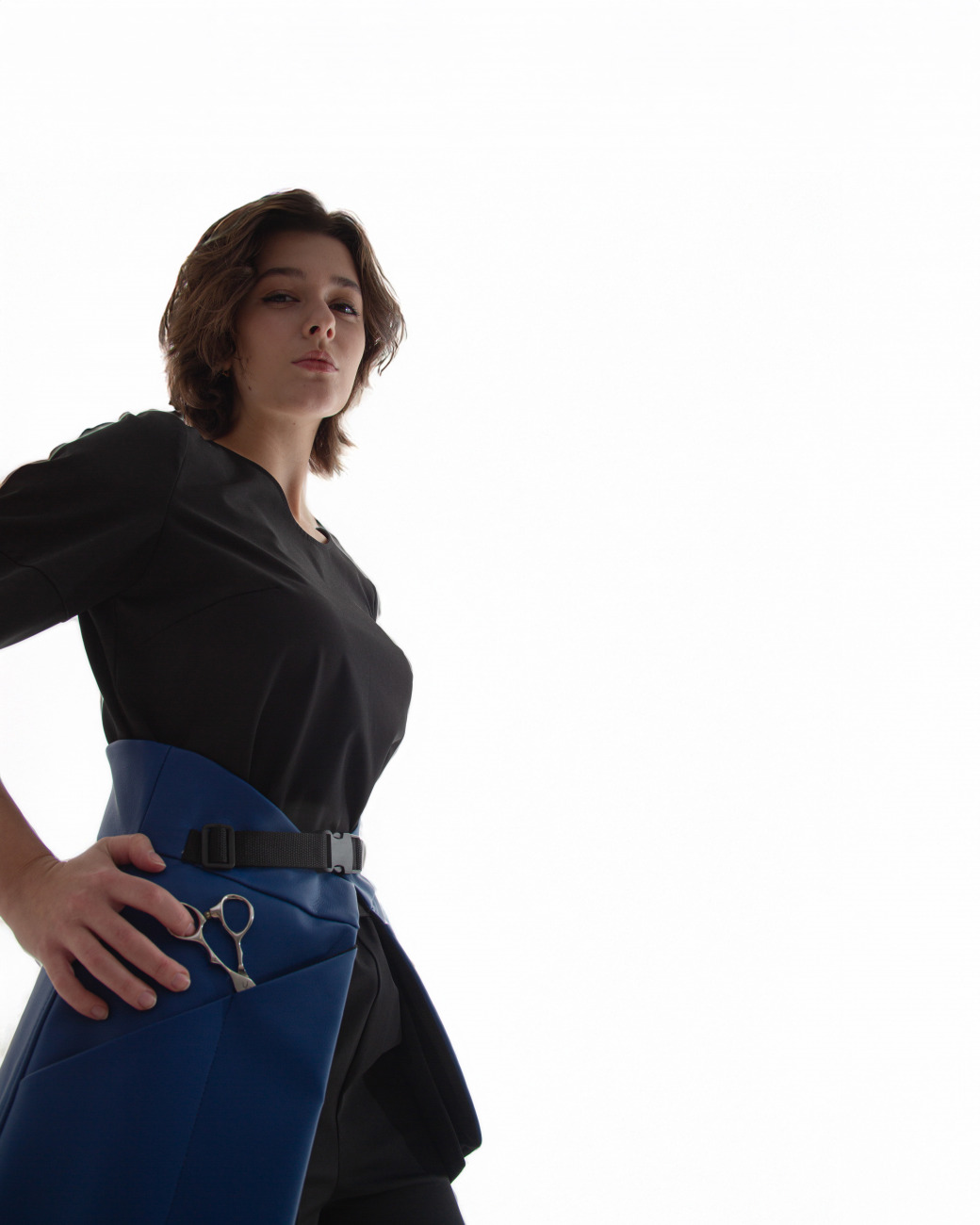 top t shirt with small openings for scissors and hair clips located on the sleeve, designed for women hairstylists